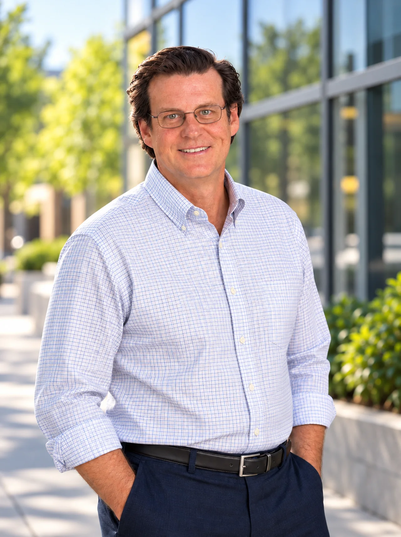 Scott Milne of Rocky Mountain Efficiency Group outside a commercial building.