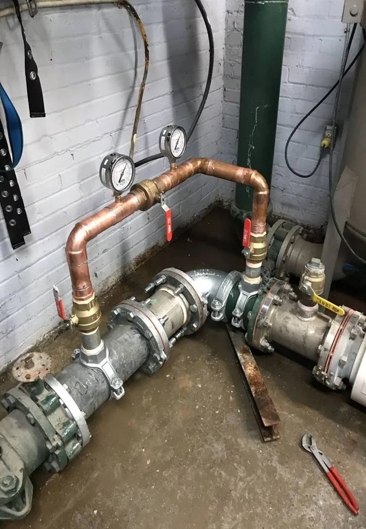 Water Flow Management device installed on a commercial building's incoming water line